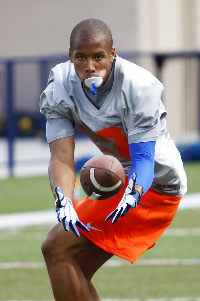 Bishop Gorman tight end Alize Jones pulls in a pass while  taking part in the Gaels spring practice Tuesday, May 7, 2013.