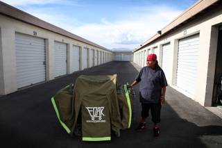 Erma Hernandez, who has been homeless in Las Vegas for three years, stands with her EDAR housing unit on Wednesday, May 8, 2013, outside her storage unit on Bonanza Road in Las Vegas. Though she has been sleeping in the EDAR (Everyone Deserves a Roof), a compact portable housing unit on wheels, for the past month or so, she will not sleep in it tonight for fear that Metro Police will confiscate it from her. The EDAR was given to her by Project Aqua, a local homeless advocacy group.