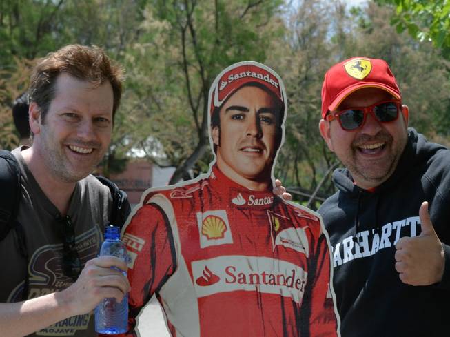 Las Vegas Wranglers President Billy Johnson stands with a cutout of Formula One ace Fernando Alonso and the guy who carries him around.