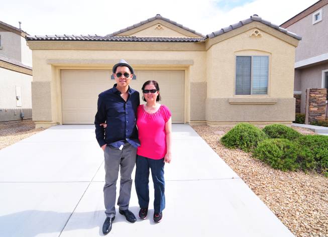 Michael Luangrath, 29, gave his mother, Dao Vahn, a longtime downtown Las Vegas business owner and cancer survivor, a $175,000 house for Mother's Day. The mother and son are shown here in a photo of her house in North Las Vegas on Thursday, May 16, 2013.