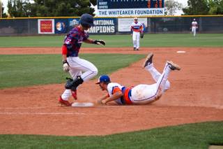 Bishop Gorman's Nick Gates tags the base to get out Coronado's Michael Maiello during the Division I State Championship game at William R. Morse Stadium at the College of Southern Nevada Saturday, May 18, 2013. The Cougars won 7-4 against the defending champion Gaels.