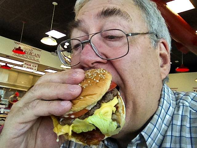 Tom Gorman enjoys a Five Guys burger.