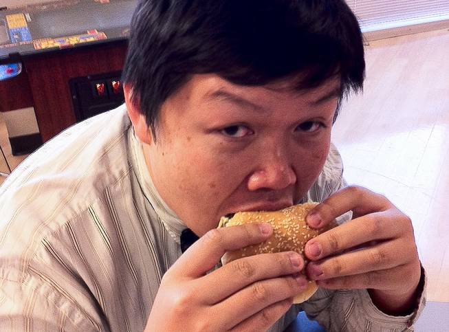 Don Chareunsy devours a Jumbo Jack with cheese from Jack in the Box ($1.99).