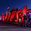 A tourist takes a photo at the Neon Museum in Las Vegas on Friday, May 24, 2013. For the past six months, visitors have had to squint up at the hulking metal forms through the desert sun. On Friday, the museum unveiled nighttime hours. 