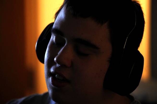 Ido Kedar, who is a non-verbal autistic teenager, wears headphones due to his heightened sensitivity to sound while attending classes at Canoga Park High School in Canoga Park, Calif., in June 2013. Kedar is also the author of the book, "Ido in Autismland - Climbing Out of Autism's Silent Prison," which was published in 2012.