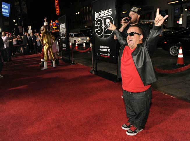 Jason "wee man" Acuna, right, a cast member in "Jackass 3D," poses at the premiere of the film in Los Angeles, Wednesday, Oct. 13, 2010, in Los Angeles. 