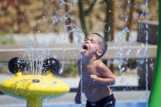 Paul Marino Jr., 4, plays at Charlie Frias Park Sunday, June 9, 2013. Sunday's high temperature was 109, two degrees shy of the record.