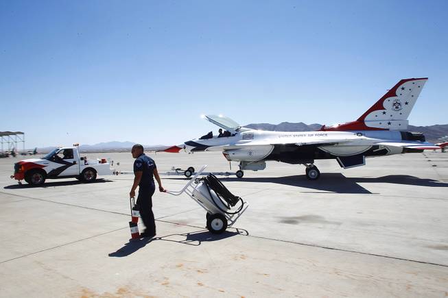 A Thunderbird F-16 is towed to its hangar June 13, 2013 at Nellis Air Force Base.
