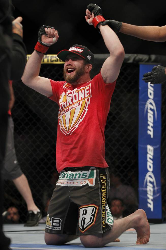 Mitch Clarke celebrates his win over John Maguire in a lightweight bout during UFC 161 in Winnipeg on Saturday June 15, 2013. 