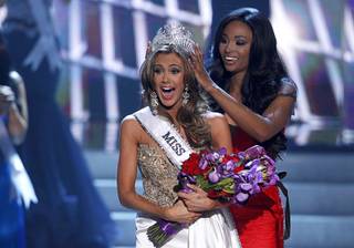 Miss Connecticut Erin Brady reacts as she is crowned by Miss USA 2012 Nana Meriwether during the Miss USA pageant at Planet Hollywood Sunday, June 16, 2013.