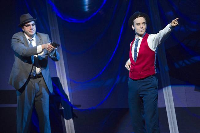 FBI Agent Carl Hanratty (Merritt David Janes) holds Frank Abagnale Jr. (Stephen Anthony) at gunpoint during "Catch Me If You Can" at the Smith Center for the Performing Arts Tuesday, June 18, 2013. The Broadway musical based on the exploits of Frank Abagnale Jr., a con artist in the 1960s, runs through Sunday, June 23.
