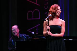 Tara Palsha accompanied by Bill Fayne, sings during a performance of the Broadway-based open mic and variety show Cast Party Wednesday, June 19, 2013 at Cabaret Jazz at the Smith Center.