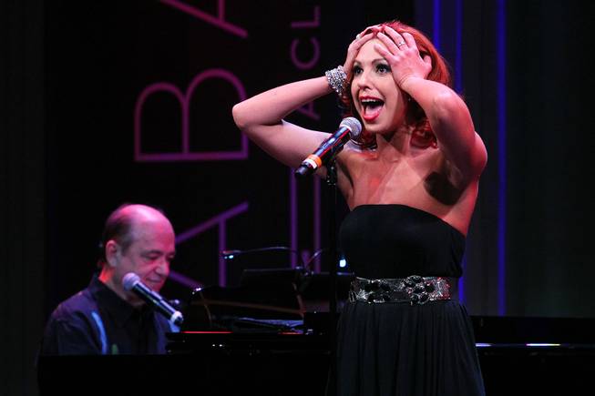 Tara Palsha accompanied by Bill Fayne, sings during a performance of the Broadway-based open mic and variety show Cast Party Wednesday, June 19, 2013 at Cabaret Jazz at the Smith Center.