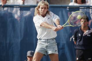 Andre Agassi, U.S. open sixth seed, takes a swing at the ball as he plays in the quarterfinals in New York, Thursday, Sept. 7, 1989. He faces Jimmy Connors, seeded thirteenth. 