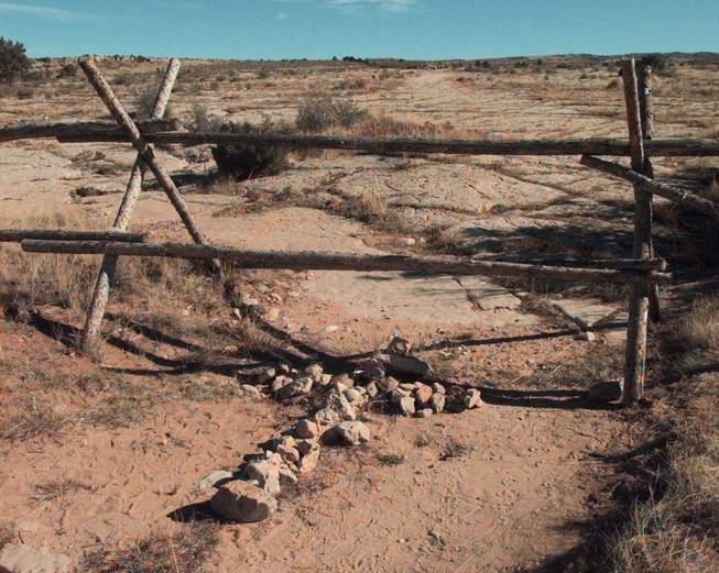  In this Saturday, Oct. 9, 1999 file photo, a cross made of stones rests below the fence in Laramie, Wyo. where a year earlier, gay University of Wyoming student Matthew Shepard was tied and pistol whipped into a coma. He later died. The killers, police said, targeted him because he was gay. Congress passed anti-hate crimes legislation bearing his name in 2009. 