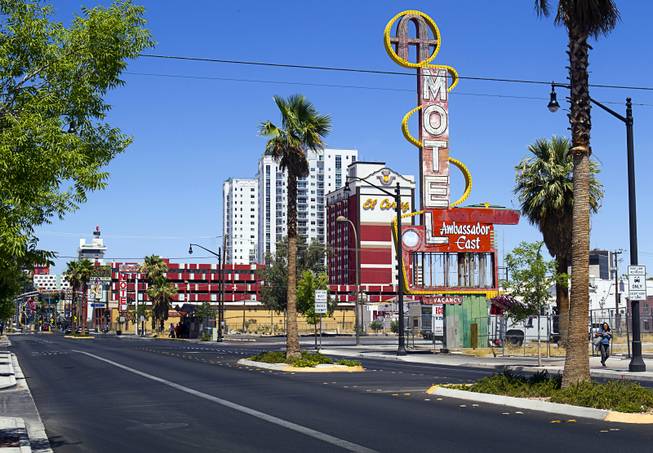 The Ambassador East Motel sign, right, is shown on East Fremont Street Wednesday, June 20, 2013. The motel was demolished in 2007 but the sign is being refurbished in time for the inaugural Life is Beautiful festival. 