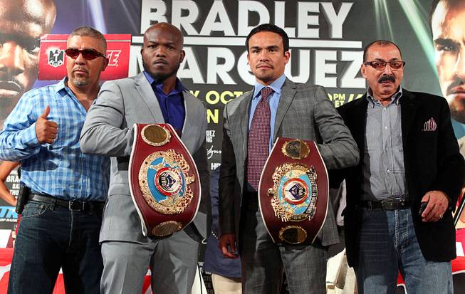 June 20, 2013,Beverly Hills,Ca.    --- Trainers: Joel Diaz, Nacho Beristan -- (L-R) Undefeated WBO welterweight champion Timothy Bradley and four-division champion Juan Manuel Marquez during the press conference at the Beverly Hills Hotel to announce their upcoming Oct. 12 championship fight at the Thomas & Mack Center in Las Vegas, Nevada.   .Chris Farina - Top Rank.