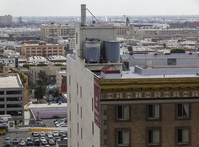 This Feb. 21, 2013, photo shows water tanks on the roof of the Cecil Hotel in Los Angeles. Canadian tourist Elisa Lam had been missing for about two weeks when officials at the Cecil Hotel found her body in a water cistern on the hotel roof.