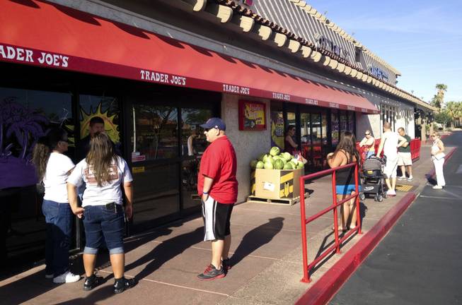 Shoppers wait outside Trader Joe's on Green Valley Parkway on June 21, 2013, shortly before its 8 am opening. At least four people were there to buy the popular Speculoos Cookie Butter.