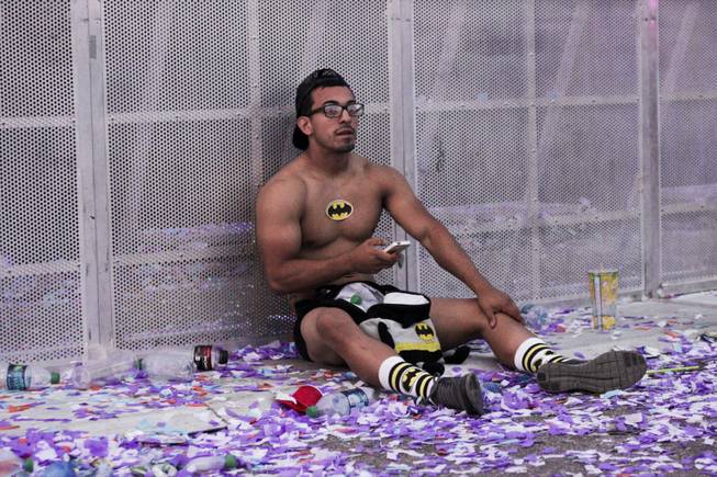 A fan rest during the Headhunterz set at the Electric Daisy Carnival Festival, EDC, at the Las Vegas Motor Speedway, Sunday morning, June 23, 2013.