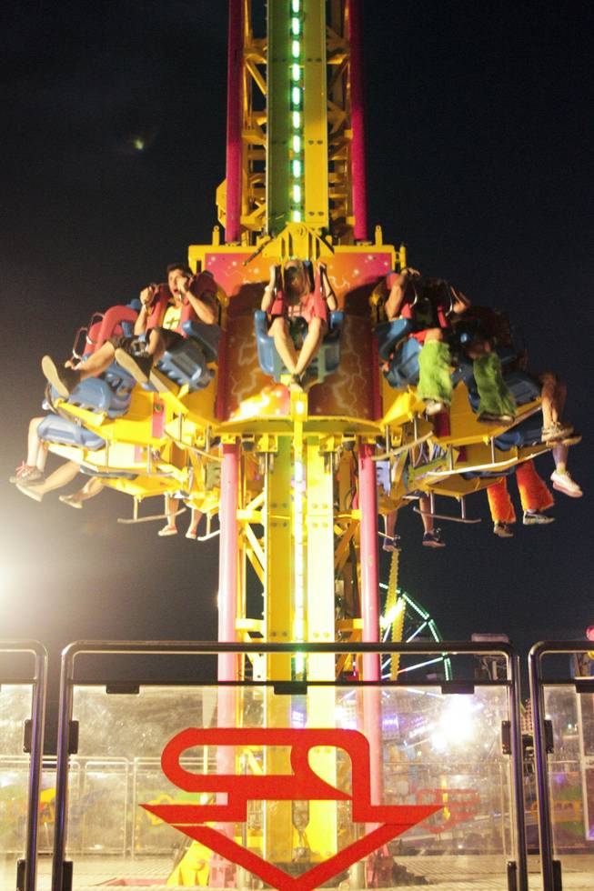 Festival attendees ride the Mega Drop at the Electric Daisy Carnival Festival, EDC, at the Las Vegas Motor Speedway, Sunday morning, June 23, 2013.