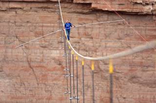  Nik Wallenda walks across a 2-inch wire 1500 feet above the ground to cross the Grand Canyon for Skywire Live With Nik Wallenda on the Discovery Channel, Sunday, June 23, 2013 at the Grand Canyon, Calif.