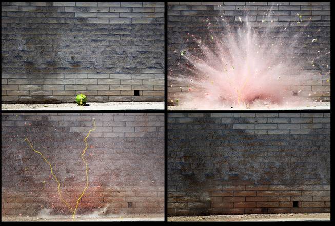 A watermelon is blown up with a blasting cap during the Las Vegas Fire Department's annual July 4th fireworks safety demonstration Wednesday, June 26, 2013