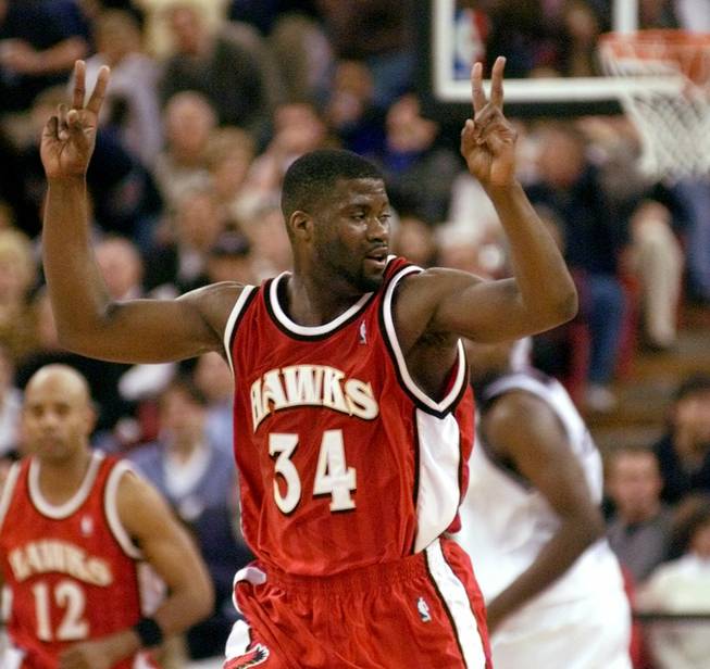 The Atlanta Hawks' JR Rider celebrates after a late-game basket against the Sacramento Kings on Feb. 23, 2000, in Sacramento, Calif. Rider scored a game-high 33 points to lead the Hawks to a 100-94 win.