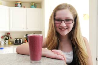 Bella Gross is seen with a glass of her contest winning smoothie Friday, June 28, 2013. Bella is the Nevada winner of the 