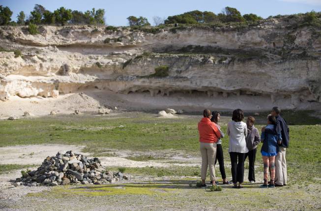 U.S. President Barack Obama, right, and his family visit the rock quarry where prisoners of Robben Island were once forced to work during a tour of Robben Island, South Africa, on Sunday, June 30, 2013. Robben Island is a historic Apartheid-era prison that held black political prisoners, including former South African president and anti-apartheid hero Nelson Mandela. From left are niece Leslie Robinson, daughter Malia, first lady Michelle Obama, mother in-law Marian Robinson, daughter Sasha and Obama.