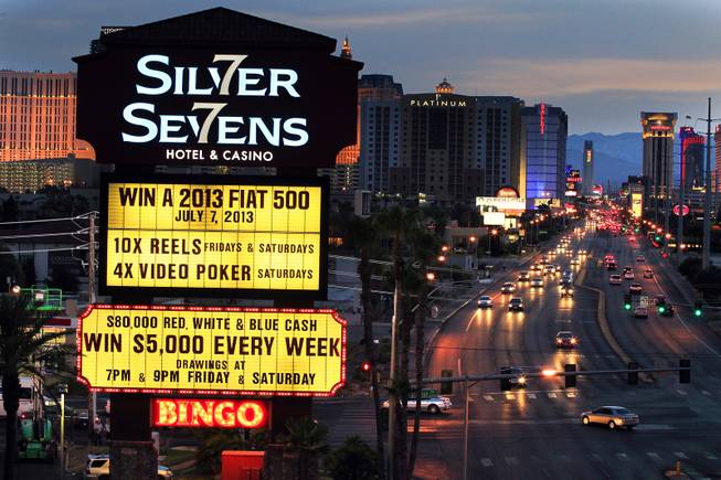 The neon sign at Silver Sevens Hotel & Casino is ceremonially lit in Las Vegas on Monday, July 1, 2013. Silver Sevens Hotel & Casino was formerly known as Terrible's Hotel and Casino.