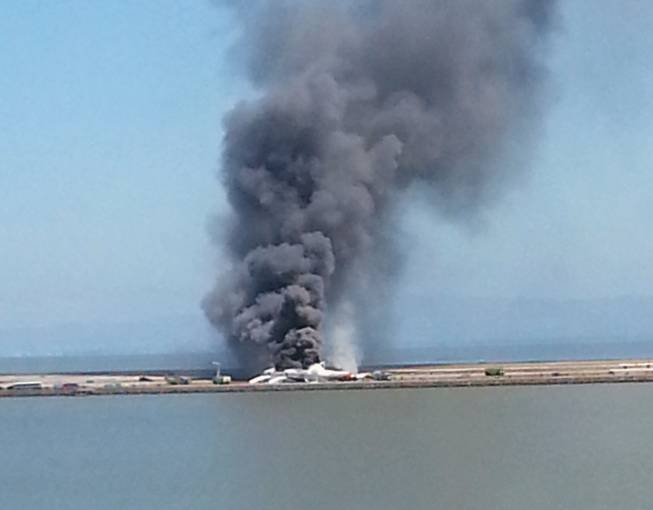 This photo provided by Antonette Edwards shows what a federal aviation official says was an Asiana Airlines flight crashing while landing at the San Francisco airport Saturday, July 6, 2013.