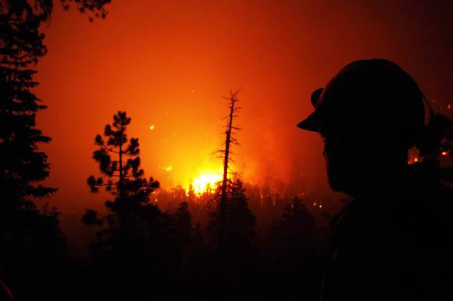 These are photos taken by firefighter Jason Mumford during his overnight shift near the Rainbow Subdivision while fighting the Mount Charleston fire late Tuesday, July 9, 2013, and early Wednesday, July 10, 2013.