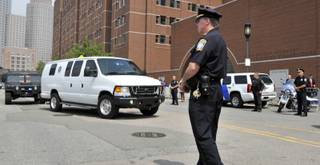 A U.S. Marshal's van, believed to be carrying Boston Marathon bombing suspect Dzhokhar Tsarnaev, arrives at the federal courthouse for his arraignment Wednesday, July 10, 2013, in Boston. 