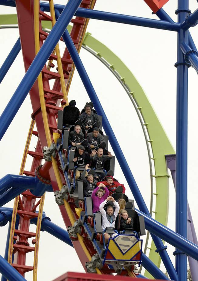 Riders on the Superman: Ultimate Flight roller coaster at Six Flags Discovery Kingdom in Vallejo, Calif., July 12, 2013. In one topsy-turvy, dizzying trip from the Bay Area to Los Angeles, Mekado Murphy recently rode 40 roller coasters in eight parks across California. 