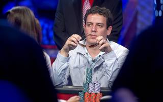 Carlos Mortensen of Spain, 2001 main event winner, competes during the seventh day of the World Series of Poker $10,000 buy-in no-limit Texas Hold 'Em at the Rio Monday, July 15, 2013.