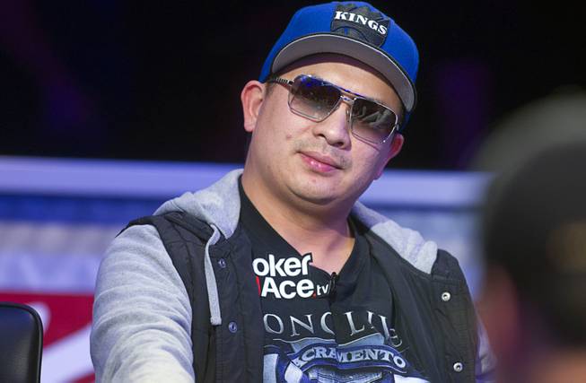 JC Tran of Sacramento, Calif. competes during the seventh day of the World Series of Poker $10,000 buy-in no-limit Texas Hold 'Em at the Rio Monday, July 15, 2013.