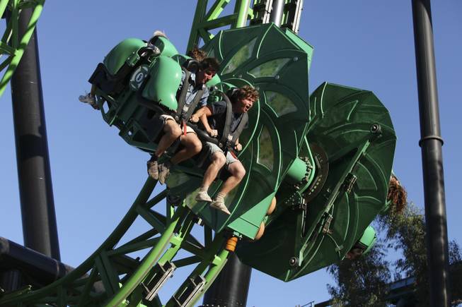 Riders on the The Green Lantern: First Flight roller coaster at Six Flags Magic Mountain in Valencia, Calif., July 15, 2013. In one topsy-turvy, dizzying trip from the Bay Area to Los Angeles, Mekado Murphy recently rode 40 roller coasters in eight parks across California.
