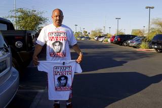 Eddie E. poses with a Trayvon Martin T-shirt before a town hall discussion at the Pearson Community Center in North Las Vegas Wednesday, July 17, 2013. The discussion, titled After Trayvon Martin: What Now?, attracted more than 200 people. The Phi Beta Sigma fraternity sponsored the event.