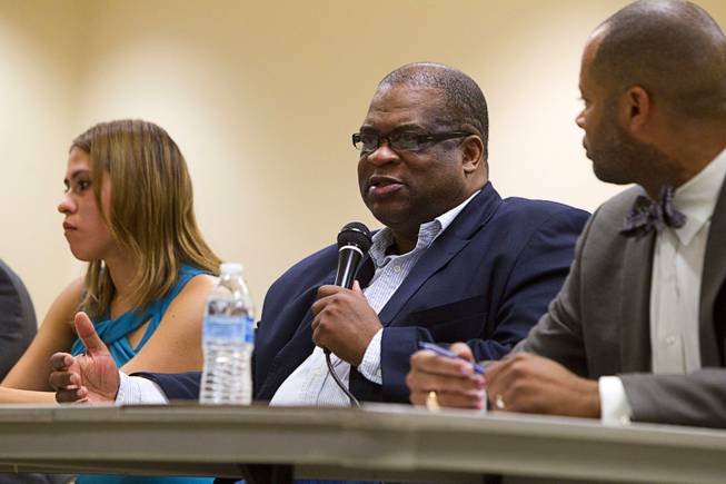 Pastor Robert E. Fowler Sr., center, of Victory Missionary Baptist Church, speaks during a town hall discussion at the Pearson Community Center in North Las Vegas Wednesday, July 17, 2013. The discussion, titled After Trayvon Martin: What Now?, attracted more than 200 people. The Phi Beta Sigma fraternity sponsored the event.