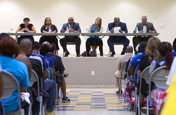 Panel members speak during a town hall discussion at the Pearson Community Center in North Las Vegas Wednesday, July 17, 2013. From left are: State Assemblywoman Dina Neal (D), Laura Martin, communications director for Progressive Leadership Alliance of Nevada (PLAN), Metro Police Lt. William Scott, Jessica Padron, political liaison for UNLV Young Democrats, Pastor Robert E. Fowler Sr. of Victory Missionary Baptist Church, and State Assemblyman Aaron Ford (D).