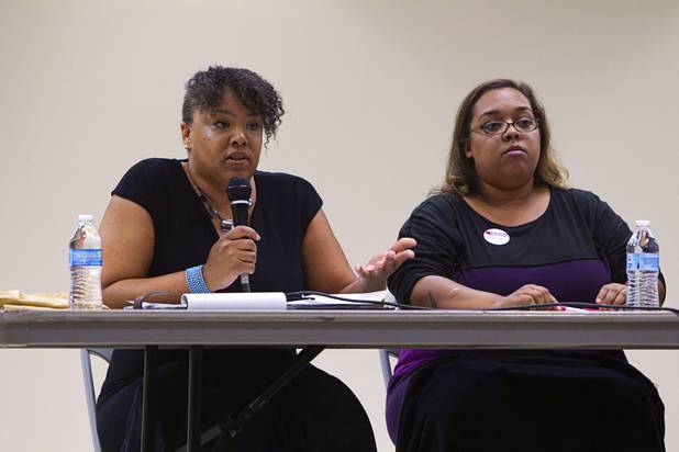 State Assemblywoman Dina Neal, left, (D) speaks during a town hall discussion at the Pearson Community Center in North Las Vegas Wednesday, July 17, 2013. Laura Martin, communications director for Progressive Leadership Alliance of Nevada (PLAN), listens at right.
