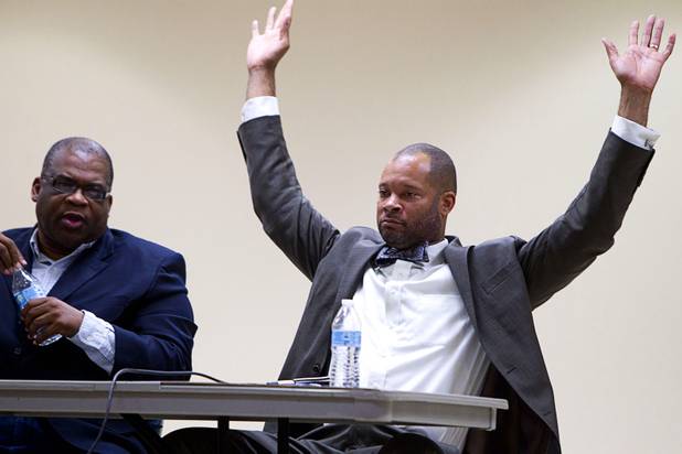State Assemblyman Aaron Ford (D) throws up his hands as Pastor Robert E. Fowler Sr. of Victory Missionary Baptist Church looks on at left during a town hall discussion titled After Trayvon Martin: What Now? at the Pearson Community Center in North Las Vegas Wednesday, July 17, 2013. The Phi Beta Sigma fraternity sponsored the event.