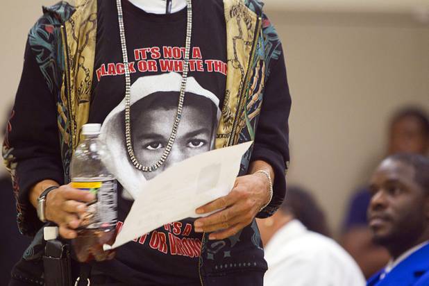 A man wears a T-shirt with the image of Trayvon Martin during a town hall discussion at the Pearson Community Center in North Las Vegas Wednesday, July 17, 2013. The discussion, titled After Trayvon Martin: What Now?, attracted more than 200 people. The Phi Beta Sigma fraternity sponsored the event.