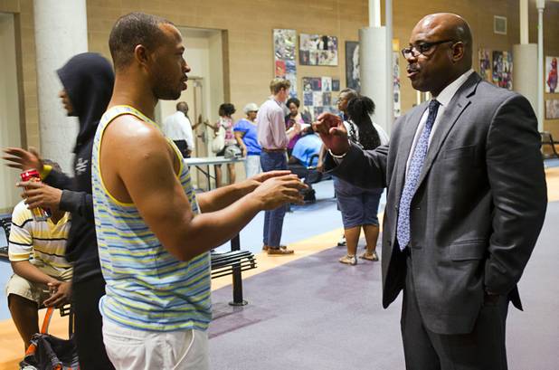Errol Campbell, left, talks with Metro Police Lt. William Scott following a town hall discussion at the Pearson Community Center in North Las Vegas Wednesday, July 17, 2013. The discussion, titled After Trayvon Martin: What Now?, attracted more than 200 people. The Phi Beta Sigma fraternity sponsored the event.