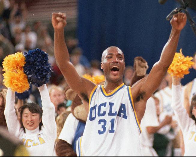 In this April 3, 1995, photo, UCLA's Ed O'Bannon celebrates after his team won the NCAA championship game against Arkansas in Seattle. 