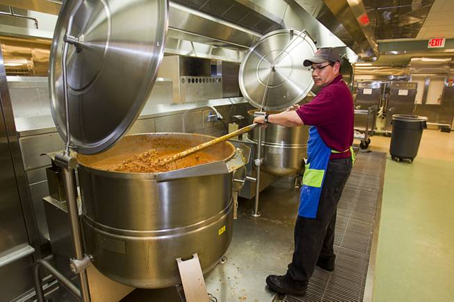 Jose Rodriguez, an Aramark worker. stirs a pot of chili in the kitchen during a tour of the Clark County Detention Center Tuesday, July 23, 2013.