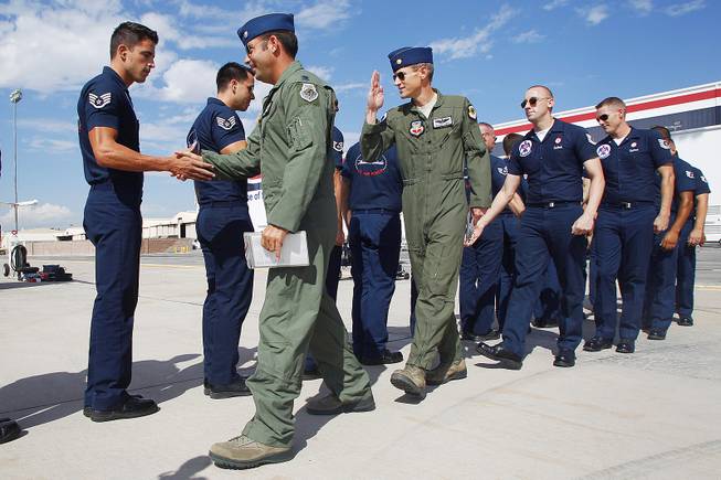 Lt. Col. Greg Moseley, right, and Maj. Blaine Jones greet their flight crews as the Thunderbirds resume limited flight operations at Nellis Air Force Base Tuesday, July 22, 2013 after having to stand down since April because of sequestration.