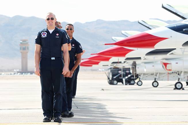 Flight crews line up to greet pilots as the Thunderbirds resume limited flight operations at Nellis Air Force Base Tuesday, July 22, 2013 after having to stand down since April because of sequestration.