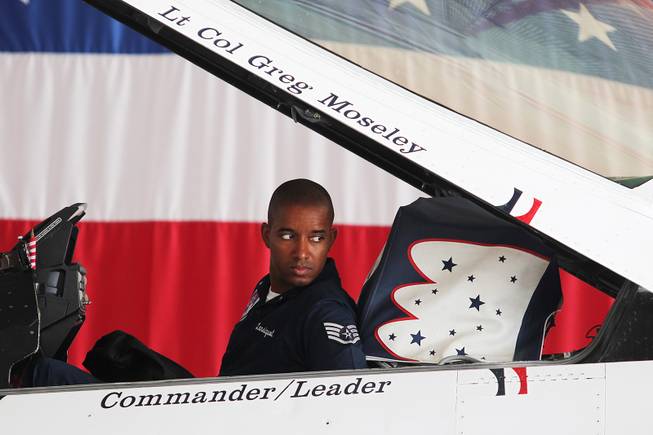 Staff Sgt. McGarry Lansiquot sits in the cockpit of an F-16 as it is moved through the hangar as the Thunderbirds resumed limited flight operations at Nellis Air Force Base Tuesday, July 22, 2013 after having to stand down since April because of sequestration.